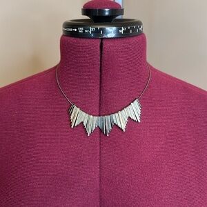 Silver gun medal waterfall statement necklace